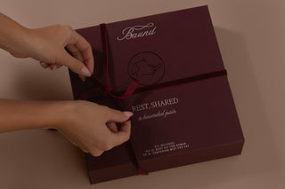 Rest, Shared ritual box tied with ribbon being unwrapped by hands
